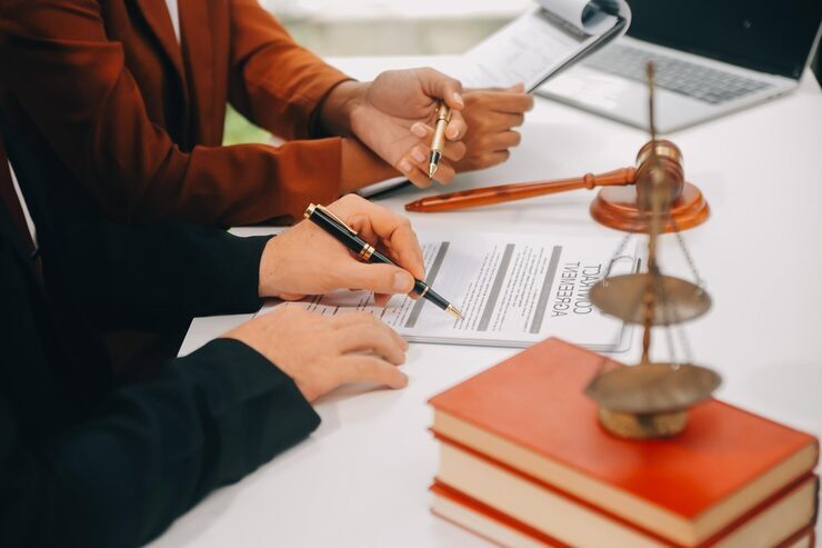 imgi_18_business-lawyers-discussing-contract-papers-with-brass-scale-desk-office-law-legal-services-advice-justice-law-concept-picture-with-film-grain-effect_265022-70493.jpg
