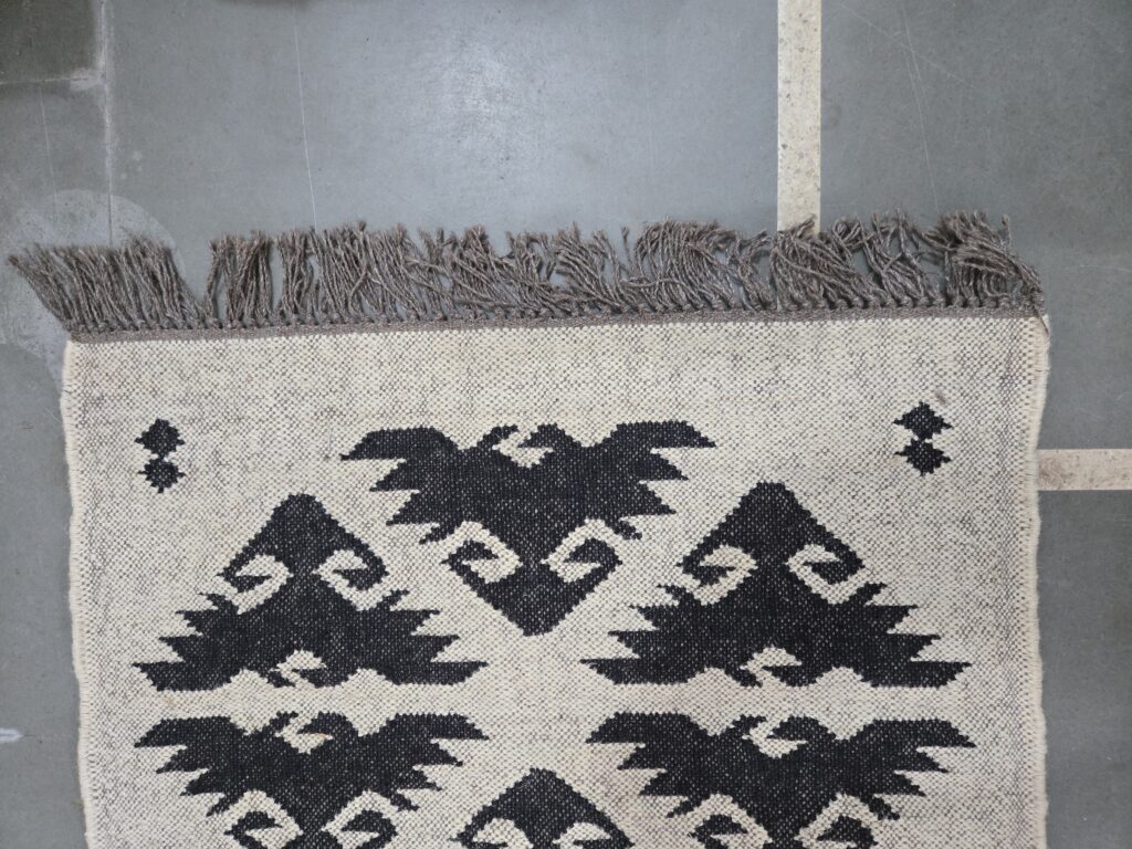 Handwoven rug India traditional design.jpg