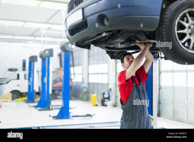 car-mechanic-working-at-automotive-service-center-KK9B7K.jpg