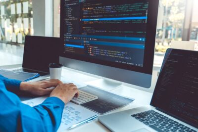 software-developer-coding-at-desk-with-multiple-mo-2026-01-06-10-44-40-utc.JPG