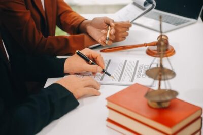 imgi_18_business-lawyers-discussing-contract-papers-with-brass-scale-desk-office-law-legal-services-advice-justice-law-concept-picture-with-film-grain-effect_265022-70493.jpg