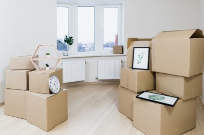 stack-moving-cardboard-boxes-new-apartment_23-2148060032.jpg